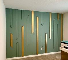 an empty room with green walls and gold trimmings on the door, carpeted floor