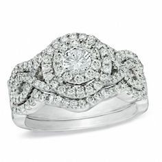 a wedding ring set with two rows of diamonds on top of each other and the words celebration