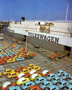 cars are parked on the tarmac in front of an aircraft carrier at volkswagen