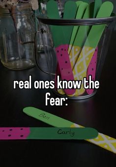 the words real ones know the fear are in front of a cup with toothbrushes