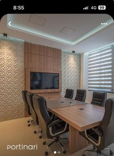 a conference room with chairs and a flat screen tv