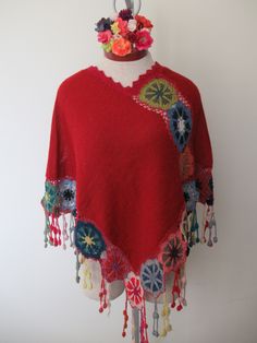 Beautiful and Unique Poncho with 100% Baby Alpaca This red gorgeous poncho is handknitted with a very thing thread of 100% baby alpaca that was naturally dyed with plants in the Altiplano of Peru, handmade by women from Pisac in the Andes of Peru. Alpaca wool is one of the most resistant and soft fibers in the world, it does not cause allergies, it is lightweight and so comfortable that its special for hand knitting. Alpaca wool is naturally breathable. We believe in the properties of natural fi Multicolor Bohemian Wool Poncho, Red Bohemian Poncho For Festival, Traditional Red One-size Poncho, Red Bohemian Shawl Poncho, Handmade Alpaca Poncho Shawl, Bohemian Alpaca Hand Knitted Shawl, Handmade Alpaca Shawl Poncho, Bohemian Alpaca Shawl One Size, Bohemian Alpaca Shawl