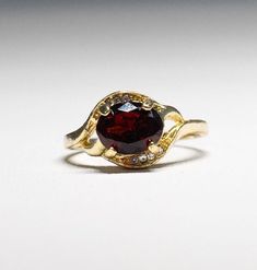 Gorgeous gold-plated faceted Garnet Crystal Ring-  January birthstone- with dazzling crystals.  size 9.75. It shines like real gold. GREAT Gift! No Tarnish It will come in a gift bag Gold Jeweled Rings For Gift, Gold Cubic Zirconia Crystal Birthstone Ring, Gold Crystal Birthstone Ring With Cubic Zirconia, Gold Birthstone Ring With Cubic Zirconia, 14k Gold Faceted Birthstone Ring, Jeweled Rings As Gifts, Gold Jeweled Crystal Ring Gift, Gold Garnet Round Cut Jewelry, Gold Crystal Birthstone Ring For Promise