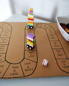 a board game with dices and cars on it