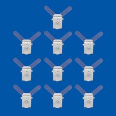 six white propellers are arranged in the shape of a square and rectangle pattern on a blue background