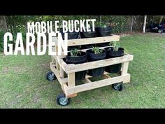 a mobile bucket garden cart with potted plants on it and the words mobile bucket garden