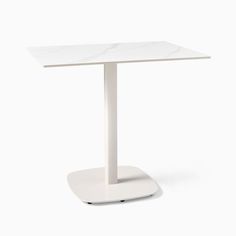 a white table with a marble top on a white base, viewed from the front