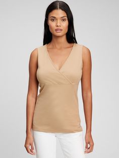 Made with 48% organically grown cotton.  Organic cotton is better for people and the environment because it's grown without the use of harmful synthetic pesticides and fertilizers.  Soft modal-blend jersey.  Crossover V-neck for easy nursing.  Tank straps.  Shirring at empire waist.  Please note: Maternity styles cannot be returned in store.  Please enjoy free returns by mail. Gap V-neck Summer Tops, Gap Tops For Spring, Versatile Cotton V-neck Tops, Gap V-neck Tops For Spring, Spring Organic Cotton Stretch Tops, Versatile Cotton V-neck Tank Top, Fitted Sleeveless Organic Cotton Top, Stretch Cotton V-neck Top For Spring, Solid Color Cotton V-neck Tank Top