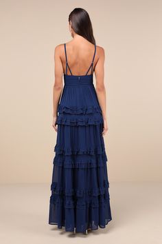 Simple yet stunning, there are so many elements of the Lulus Lavish Perfection Navy Blue Ruffled Tiered Maxi Dress that you'll love! This lovely dress is composed of lightweight woven chiffon that shapes a lightly gathered bodice, a flirty V-neckline, and adjustable spaghetti straps. The high, pleated banded waist tops an elegant A-line maxi skirt adorned with tiers of ruffled detailing throughout for an ultra-femme finish. Hidden back zipper/clasp. Fit: This garment fits true to size. Length: F Simple Long Homecoming Dresses, Bridesmaid Maxi Dress, Navy Blue Long Dresses, Formal Dresses Ruffles, Long Navy Blue Dress Outfit Casual, Floor Length Formal Dress, Blue Long Formal Dress, Blue Tiered Dress, Prom Dress Navy