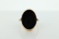 This is a super unique ring. Will work great for women and men alike. Excellent Pinkie ring.  Onyx bezel set. Made in the 30s. Condition: Shows minimal signs of wear. Has not been polished. Onyx has some scratches that show in the light. Details: 10k Yellow Gold Marked 10k  12mm by 16mm Oval Onyx 3mm rise sz 5 Antique Oval Signet Ring With Polished Finish, Vintage Domed Rings With Polished Finish, Victorian Oval Signet Ring With Polished Finish, Classic Oval Signet Ring Collectible, Oval Cabochon Signet Ring For Formal Events, Oval Cabochon Signet Ring For Formal Occasions, Classic Domed Cabochon Signet Ring, Formal Oval Signet Ring With Polished Edges, Art Deco Oval Engraved Ring For Formal Occasions