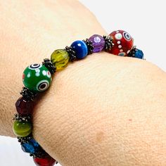 Multi-colored Boho-Hippie Lampwork Glass Bead Bracelet measures 2 3/4 inches across and stretches nice combination of different colors of glass beads Glass Bead Bracelet, Boho Bracelet, Glass Beaded Bracelets, Lampwork Glass Beads, Colorful Boho, Boho Bracelets, Boho Hippie, Bead Bracelet, Glass Bead