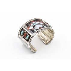 This beautiful bracelet is by Zuni artists Filbert & Clara Gasper. Circa 1960 - 1970. The bracelet is sterling silver with inlay turquoise, mother of pearl and coral. In the center is an inlaid face and on the sides there are additional bezel set turquoise and coral pieces. The next section has inlay mother of pearl rectangles. The piece has a 1" area to get your wrist into. Interior cuff length is 6.75".   Filbert and Clara Gasper are highly recognized and noted Zuni artists that are known for Artisan Inlay Bracelets As A Gift, Unique Bracelet With Inlay For Gift, Distinctive Bangle With Inlay For Gifts, Unique Bracelet With Inlay As Gift, Unique Bracelets With Inlay For Gifts, Unique Inlay Bracelet For Gift, Unique Bangle With Inlay As Gift, Unique Bangle With Inlay For Gift, Unique Silver Bracelets With Inlay