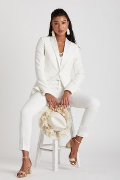 HERES TO STRONG WOMEN...
Look sharp with this classic white womans tuxedo by The Groomsman Suit. It features a beautifully tailored tuxedo jacket and tapered pants with a touch of stretch to make a statement on your wedding day... or in place of an LWD at the rehearsal dinner, bachelorette or any other bridal festivities.  

 
*Fulfilled by our friends at The Groomsman Suit
THE 411
JACKET DETAILS:

Fully-lined with single satin covered button front
Nonfunctional four-button cuffs (satin covered) Womens White Wedding Suit, White Wedding Suits For Women Brides, White Suit Outfit Woman, All White Suit Women, Masc Bride Outfit, White Tuxedo Women, Wedding Suit Women Tomboys, White Wedding Suit For Women, Bridal Suits For Women