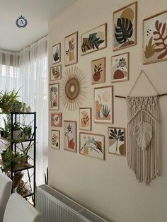 a living room filled with lots of pictures on the wall next to a radiator