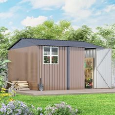 a small shed sitting on top of a lush green field