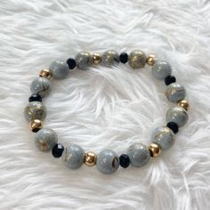 Unique Gray Bead Bracelet Features Swirls Of Gold On Beads! Accented With Round Gold Tone Beads And Faceted Black Crystal Rondelles. Stretch Cord. Measures Approx 3 1/2” Diameter Elegant Gray Stretch Bracelet As Gift, Gray Faceted Beads Bracelet As Gift, Gray Faceted Beaded Bracelets As Gift, Gray Round Beads Stretch Bracelet As Gift, Gray Beaded Bracelets With Faceted Beads As A Gift, Casual Beaded Gray Jewelry, Casual Gray Beaded Jewelry, Adjustable Gray Jewelry With Colorful Beads, Gray Jewelry With Colorful Beads For Gift