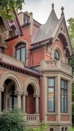 an old victorian style house with arched windows