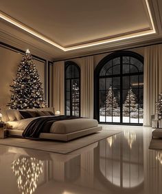 a bedroom decorated for christmas with a large bed and lighted trees in the window sill