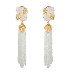 These white moonstone drop earrings with the spark of a yellow flash are so elegant worn. Modern and refined, they are a refreshing pop of white to cool any summer outfit. Handcrafted in 14K gold plated brass settings. SKU: ED-TSL-52 Lemon Quartz & Moonstone Semi-precious Stones Made to Order Convertible 2-way Measures 3" x 3/4" Material: 14K Gold plated brass Handmade in New York White Gemstone Earrings For Evening, Luxury Evening Jewelry With Tassels, Luxury White Earrings With Gemstone Accents, Luxury Dangle Tassel Jewelry, Elegant White Earrings With Natural Stones, Yellow Flash, Moonstone Drop Earrings, Interchangeable Earrings, Felt Pouch