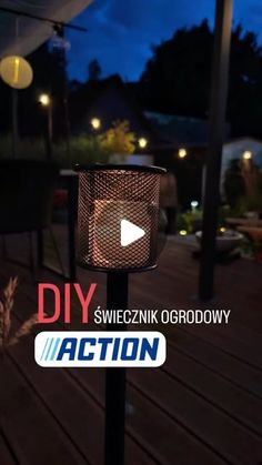 an outdoor light with the words diy action written on it and a video player in the background