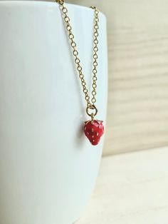 These dainty strawberry necklaces are made of the followings: (1) Gold plated strawberry charm (size: 12 x 8 mm) (2) Gold plated necklace chain ✏️ Please choose your desired color of strawberry charm ✏️ Please choose the length of the chain (the length includes clasp and findings). ❣️ If you are unsure about which length to choose , please leave me a note to request an extension chain to be added to the chain at check out. 🍓 MORE STRAWBERRY NECKLACE 🍓 → https://www.etsy.com/listing/666509218 → Delicate Enamel Jewelry For Gifts, Delicate Enamel Jewelry Gift, Cute Enamel Necklaces For Gifts, Small Red Jewelry Perfect For Gifting, Small Red Jewelry For Gift, Dainty Enamel Necklace As A Gift, Dainty Tiny Red Jewelry, Dainty Red Charm Necklace For Everyday, Delicate Handmade Red Necklace