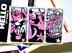 some kind of playing cards that are on top of each other with the word hello kitty painted on them