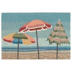 three beach umbrellas sitting on top of a sandy beach