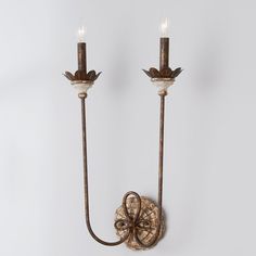 With flowery bobeches and an ornate backplate, our Olivia Wall Sconce has a unique energy in its appearance and design.  The looped decoration on the backplate connects each candle arm, adding a touch of whimsy to a sconce perfect for a hallway, entry or bedside. Gold and Antique Ivory candlesleeve options are included for your preference. Sconces Dining Room, Hallway Sconces, Rust Wall, Victorian Wall Sconces, Shades Of Light, Fluorescent Light, Distressed Wood, Wall Light Fixtures, Dining Room Lighting