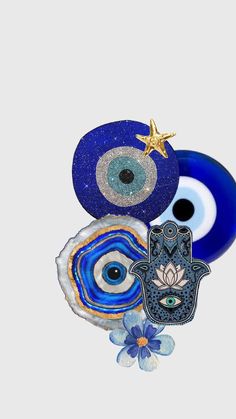 an evil eye, hamsah, and star on a white background with blue flowers