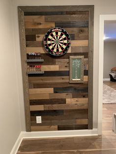 a dart board mounted to the side of a wall