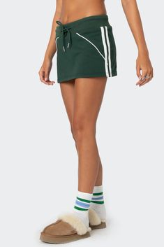 Gayil Mini Skort – edikted Sporty Summer Bottoms With Striped Hem, Sporty Striped Hem Bottoms For Summer, Sporty Green Skort For Summer, Sporty Green Mini Skirt For Spring, Casual Striped Mini Skort, Sporty Green Mini Skirt For Summer, Casual Striped Mini Length Skort, Sporty Green Skort With Elastic Waistband, Green Sporty Skort For Spring