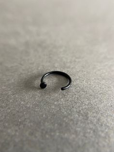 Black Tiny Circle Open Hoop Cartilage Earring - Sterling Silver ★ Quantity: One Single Hoop ★ Gauge : 20 Gauge ★ Size : 8mm / 10mm Circle Size : 2mm ★ Color : Black ★ Materials : Sterling Silver ★ Comes in a jewelry box. If you need extra boxes for gifting....just let us know! Black Hypoallergenic Minimalist Piercings, Minimalist Black Hypoallergenic Piercings, Minimalist Black Internally Threaded Cartilage Earrings, Minimalist Black Round Cartilage Earrings, Black Round Cartilage Earrings For Everyday Wear, Minimalist Black Hoop Cartilage Earrings, Minimalist Black Nickel-free Piercings, Black Nickel-free Minimalist Piercings, Black Small Hoop Cartilage Earrings For Everyday