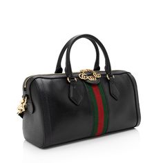 Gucci continues to reinterpret its rich heritage under current Creative Director Alessandro Michele (2015). Maintaining a balance between historical reference and contemporary eclectic flare, the brand’s signature “double g” remains iconic. Gucci has been recognized as a worldwide leader in the luxury goods market for 90 years.Condition Notes: No notable wear.Width (at base): 12.5"Height: 6"Depth: 4.75"Handle Drop: 5"Shoulder Strap Drop: 22", AdjustableType of Material: Leather, NylonColor: Blac Luxury Pouch Satchel With Handles, Burberry Sunglasses, Rug Bag, Contemporary Eclectic, Alessandro Michele, Gucci Leather, Boston Bag, Carry All Bag, S Signature