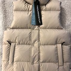 Nwt. Never Worn. Color Is "Modern Taupe." Tna Super Puff Vest, Aritzia Modern Taupe, Puffer Vest Tan, Jacket Aritzia, Khaki Nylon Vest, Puffy Vest Brown, Aritzia Jacket, Puff Vest, Cream