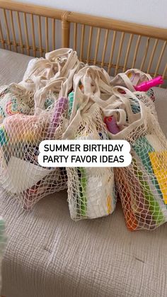 a bag full of party favors sitting on a bed with the words summer birthday party favors