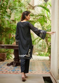 2 Piece Embroidered Suit for Women Description A classic monochromatic design envisioning captivating details that make this two-piece staple a perfect style statement for you and your little one. Kameez (Shirt) : Black Embroidered Paper Cotton Shirt.Lining included. Shalwar (Trouser) : Black Pants. Black Summer Formal Set, Elegant Black Cotton Lawn Suit, Elegant Cotton Dresses For Eid, Elegant Black Sets For Eid, Elegant Lawn Suit With Embroidered Long Sleeves, Elegant Lawn Suit With Long Embroidered Sleeves, Elegant Festive Lawn Suit With Embroidered Sleeves, Elegant Summer Kurta With Set-in Sleeves, Spring Formal Cotton Lawn Suit