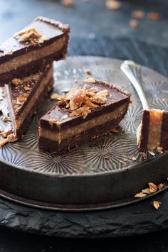 three pieces of chocolate dessert on a plate