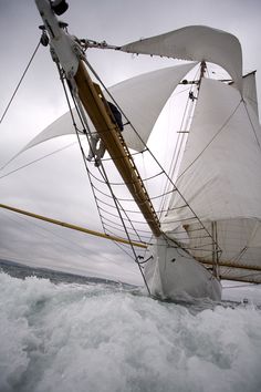 the sailboat is sailing through rough water