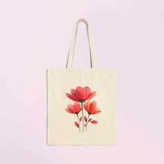 Carry your essentials in style with this minimalistic red daisy flower tote bag. The clean lines and soft pink hues of the daisy design add a touch of elegance and charm to your everyday look. Perfect for shopping, beach trips, or daily errands, this tote bag combines practicality with a serene, minimalist aesthetic. 💠 Features 💠  .: 100% cotton canvas .: Heavy fabric (12 oz/yd² (406.9 g/m .: Sewn-in label .: Available in natural and black colors  💠 sparkemotions 💠 Have a Pleasant Shopping Experience. oooooo Eco-friendly Flower-shaped Everyday Bag, Red Bags For Daily Use In Spring, Eco-friendly Red Everyday Bag, Eco-friendly Red Bag For Everyday Use, Eco-friendly Red Bags For Everyday Use, Red Floral Print Tote Bag, Red Floral Print Bags For Daily Use, Red Floral Print Rectangular Bag, Red Bags For Spring Season Gift