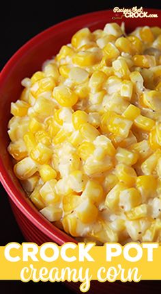 a red bowl filled with corn on top of a table