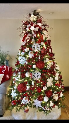 a christmas tree decorated with red and white ornaments