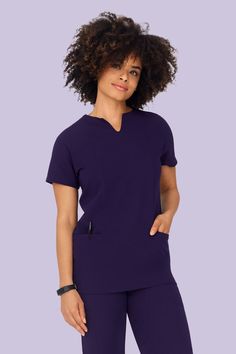 Stylish and comfy women's eggplant scrub top by Mandala Scrubs. Made from breathable, moisture-wicking fabric with 5 versatile, multi-use pockets keep any medical professional calm, cool, collected, and organized all shift long. Notch Neck Top, Moisture Wicking, Medical