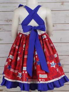 "USA America Stars & Stripes fabric Girls Halter Style Dress is perfect for all your 4th of July events. How Cute is this Style dress with a Lined bodice and Neck ruffle. Long Straps Cross in the Back and Tie into a Big Bow. Full Twirl Skirt with Star Border and Blue Ruffle Grow with Me style so it can be worn from Memorial Day to Labor Day Sizes available for Babies, Toddlers, Little Girls up to Teens Size 14 Handmade Made in the USA by me! -------------------------------------------------- Red Patriotic Dress For 4th Of July, Cheap Patriotic Sleeveless Dress, Blue Patriotic Spring Dress, Pageant Patriotic Wear, Patriotic Blue Sleeveless Dress, Girls Western Dresses, 4th Of July Events, Star Border, July Events