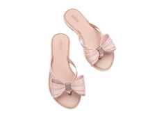 So lovely and luxe, the Slim Flip Flop brings bows to chic poolside style. Featuring a cushy footbed, metallic details and of course, ultra cute bow embellishments, slip these feminine flip flops on when you fancy some extra flair for a casual look. A little glam gets a lot of comfort.