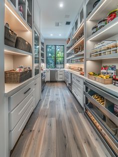 a large kitchen with lots of shelves and drawers