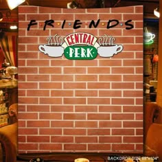 there is a brick wall with the words friends central perk on it