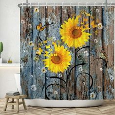 a shower curtain with sunflowers and butterflies on wooden planks in the background