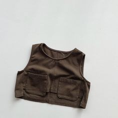 This vintage casual vest is perfect for keeping your child cozy during the spring and autumn. It is made of high-quality cotton and worsted fabric and has a comfortable O-neck design. The vest is also easy to care for, and it can be machine washed and dried. Features: Thick, warm fabric Casual style Solid color O-neck design Easy to care for Specifications: Material: Cotton, worsted Gender: Unisex Age range: Children Fit: Fits true to size Season: Spring, autumn Pattern: Solid Outerwear Type: Ve Cotton Vest With Pockets For Fall, Fall Cotton Vest With Pockets, Cotton Tank Sweater Vest For Fall, Cotton Tank Sweater Vest For Summer, Cotton Tank Top With Pockets For Summer, Casual Cotton Tank Top With Pockets, Cotton Vest Tops For Everyday, Cotton Vest Tops For Everyday Wear, Summer Cotton Tank Top With Pockets