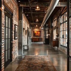 A classic industrial hallway with exposed brick walls, the red bricks contrasting with the metal accents and concrete floors1 Industrial Entrance, Industrial Hallway, Hallway Design Ideas, Industrial Era, Hallway Inspiration, Hallway Design, How To Design, Industrial Style, You Must