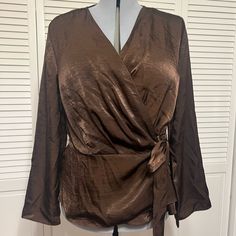 Gorgeous Wrap Blouse Elegant Faux Wrap Blouse For Party, Elegant Party Blouse With Faux Wrap, Elegant Party Faux Wrap Blouse, Elegant Brown Blouse For Brunch, Party V-neck Blouse With Faux Wrap, Party V-neck Faux Wrap Blouse, Long Sleeve Faux Wrap Party Tops, Elegant Party Top With Faux Wrap, Elegant Faux Wrap Blouse For Fall